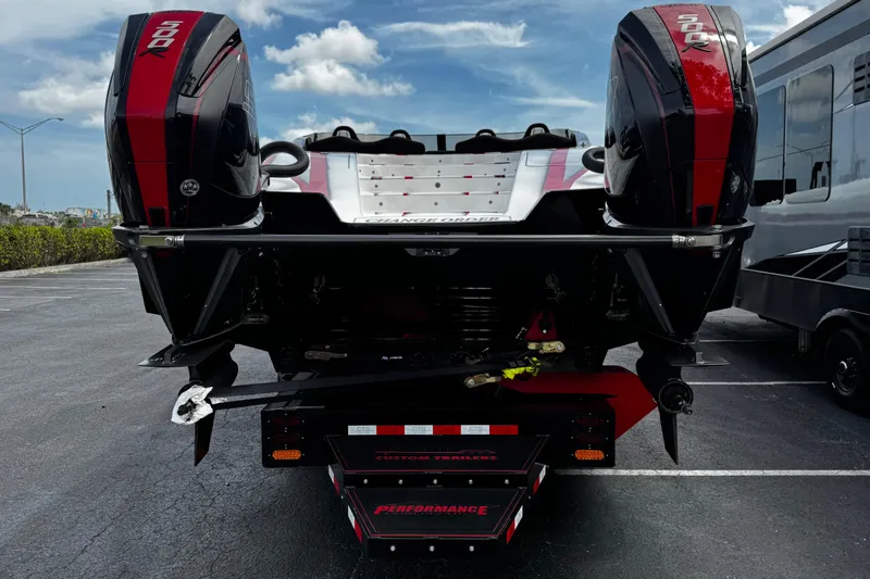 Slide: The Image of 2025 Performance Powerboats P420 with dual 500R engines on a trailer, parked outdoors. - 7
