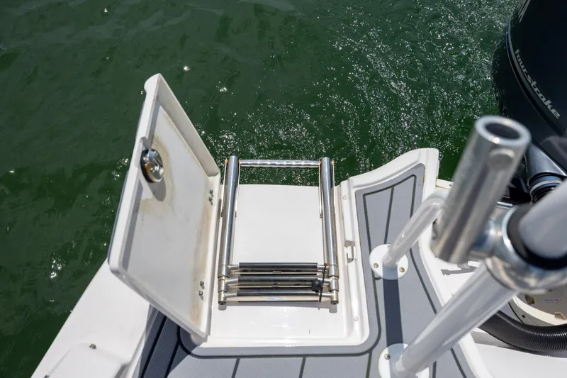Slide: The Image of 2023 Chaparral 21 SSi boat swim platform with foldable ladder and rod holders. - 20
