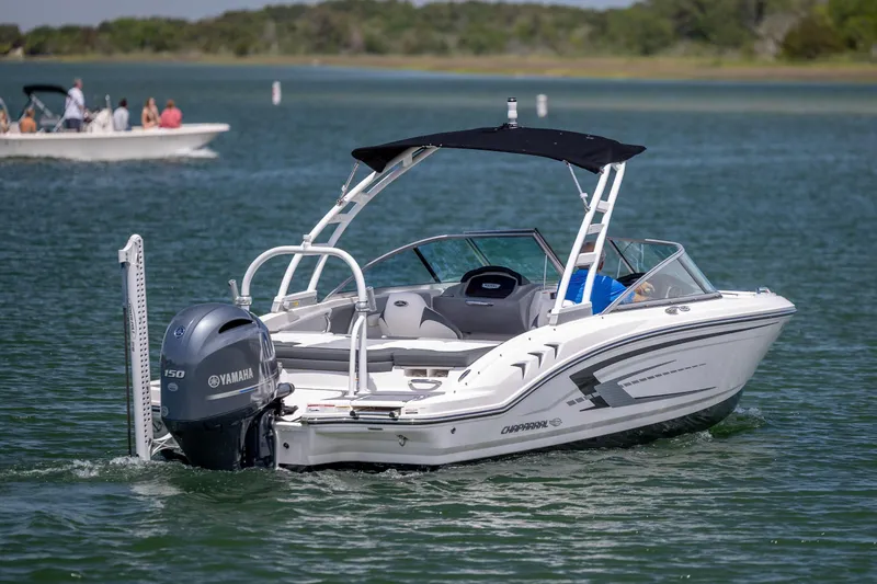 Slide: The Image of 2023 Chaparral 21 SSi boat with Yamaha engine cruising on a lake. - 5