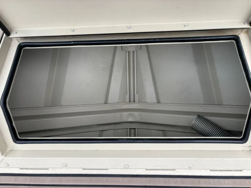 Slide: The Image of Interior view of 2026 SeaArk Easy Cat boat storage compartment. - 13