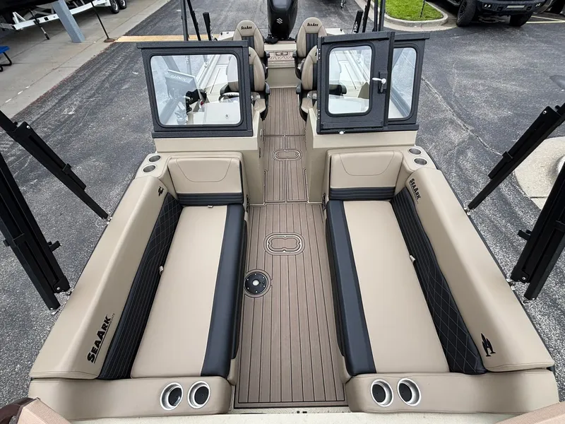 Slide: The Image of Interior of 2026 SeaArk Easy Cat with beige seating and wood flooring. - 15