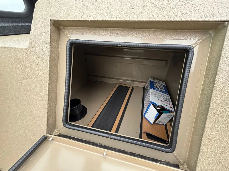 Slide: The Image of Storage compartment in SeaArk Easy Cat 2026 boat. - 24