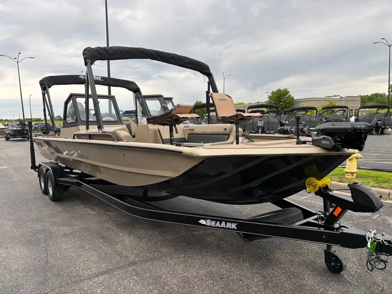 Slide: The Image of 2026 SeaArk Easy Cat boat on trailer parked outdoors. - 3