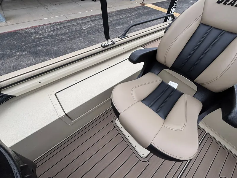 Slide: The Image of 2026 SeaArk Easy Cat boat with beige seat and wood flooring. - 30