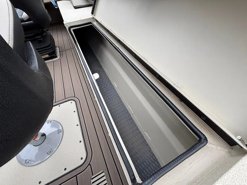 Slide: The Image of Interior of 2026 SeaArk Easy Cat with storage compartment and seating area. - 31