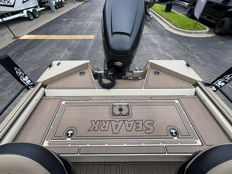 Slide: The Image of SeaArk Easy Cat 2026 boat with Suzuki motor on parking lot. - 32