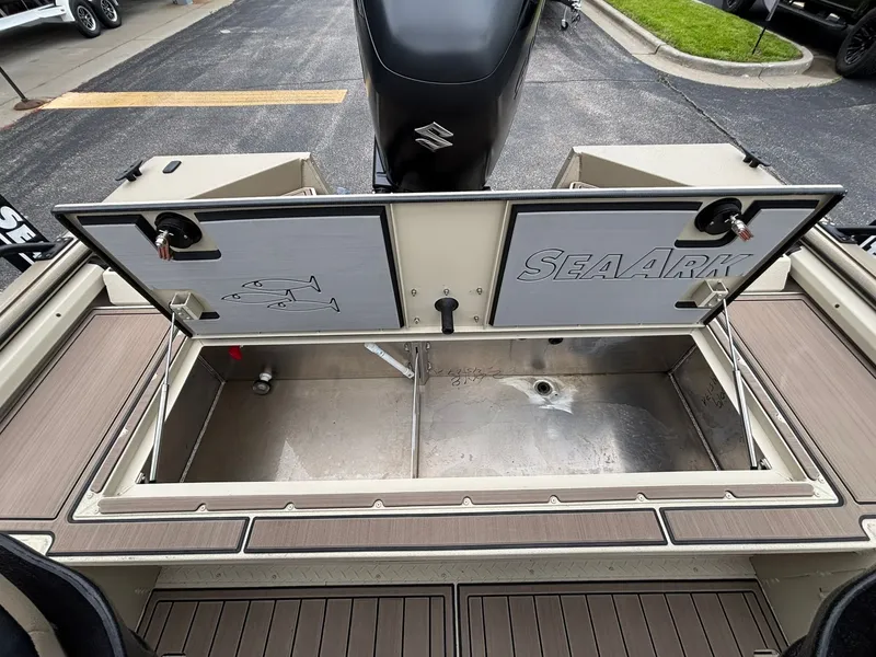 Slide: The Image of 2026 SeaArk Easy Cat boat with open storage compartment lid. - 34