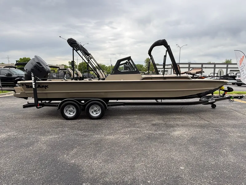 Slide: The Image of 2026 SeaArk Easy Cat boat on trailer, Suzuki motor, cloudy sky. - 4