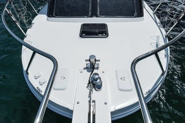 Slide: The Image of Bow view of 2011 Skipjack 300 Flybridge boat on water. - 19