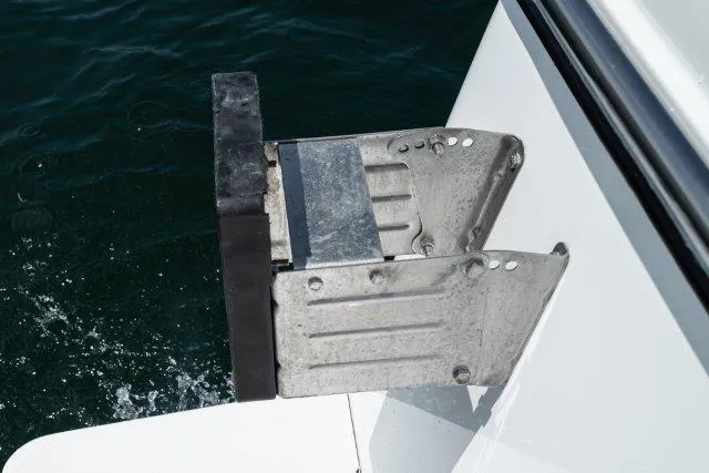 Slide: The Image of Skipjack 300 Flybridge 2011 boat accessory detail, mounted on white surface above water. - 25