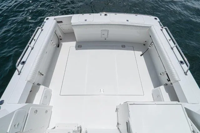 Slide: The Image of Spacious deck of 2011 Skipjack 300 Flybridge boat on water. - 28