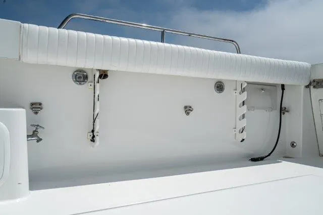 Slide: The Image of Skipjack 300 Flybridge 2011 boat interior with white seating and fixtures. - 31