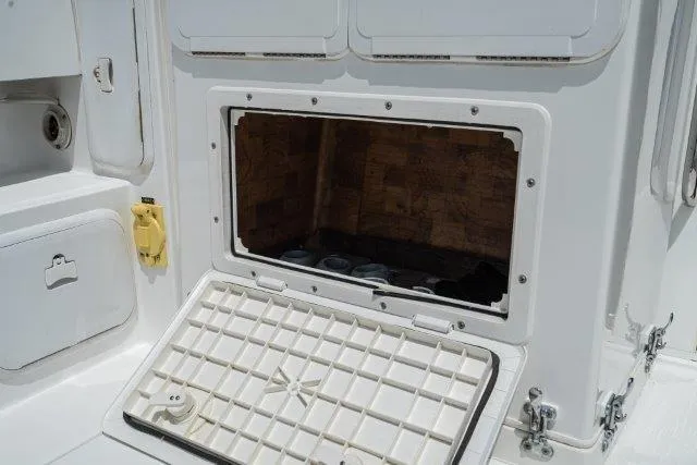 Slide: The Image of Open storage compartment on a 2011 Skipjack 300 Flybridge boat. - 39