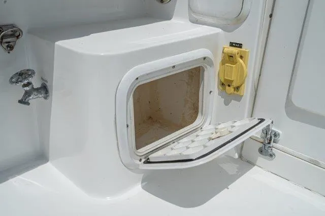 Slide: The Image of Open storage compartment on 2011 Skipjack 300 Flybridge boat deck. - 41