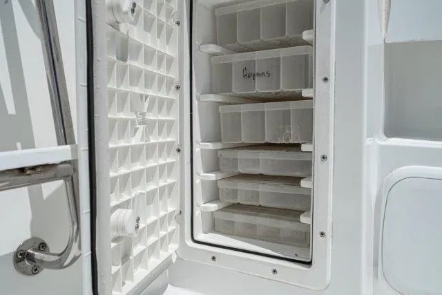 Slide: The Image of Open storage compartment on 2011 Skipjack 300 Flybridge boat. - 42