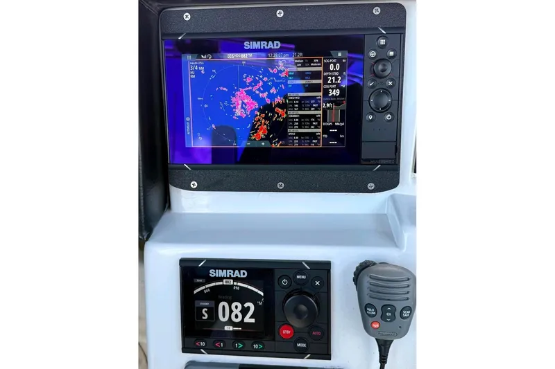 Slide: The Image of Simrad navigation system on 2011 Skipjack 300 Flybridge boat dashboard. - 51