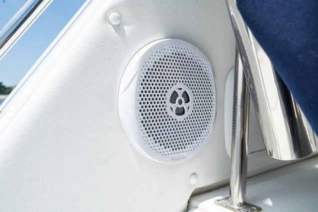 Slide: The Image of White speaker on a 2011 Skipjack 300 Flybridge boat, mounted on a sleek interior panel. - 52