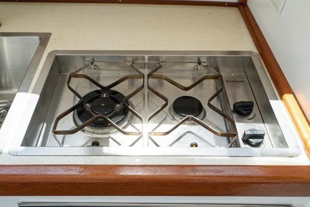 Slide: The Image of Stainless steel stove in 2011 Skipjack 300 Flybridge boat kitchen. - 64