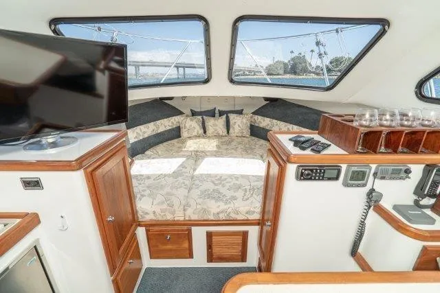 Slide: The Image of Interior of 2011 Skipjack 300 Flybridge boat with cozy cabin and modern amenities. - 69