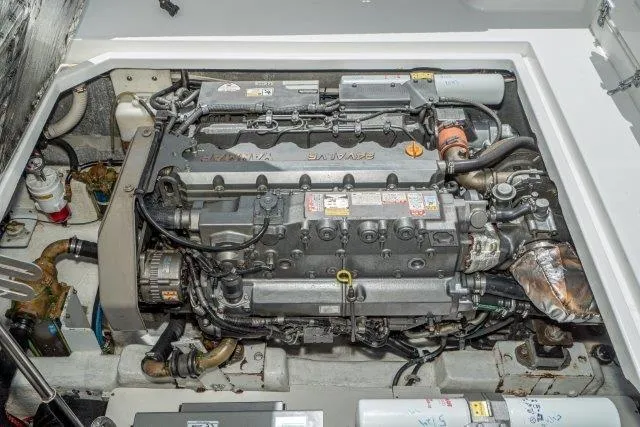 Slide: The Image of Engine compartment of a 2011 Skipjack 300 Flybridge boat, showcasing detailed mechanical components. - 80