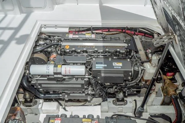 Slide: The Image of Engine compartment of a 2011 Skipjack 300 Flybridge boat, showcasing detailed machinery. - 81