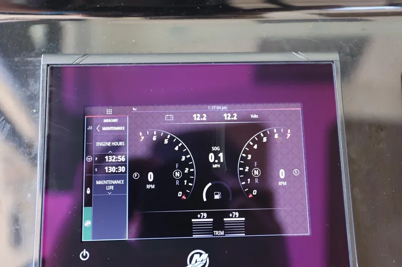 Slide: The Image of Dashboard display of a 2022 Scout 330 LXF boat showing engine hours and RPM. - 18