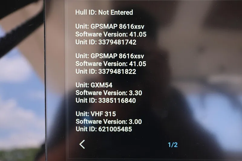 Slide: The Image of Display screen showing software versions and unit IDs for GPSMAP, GXM54, and VHF 315 on a 2022 Scout 330 LXF. - 19