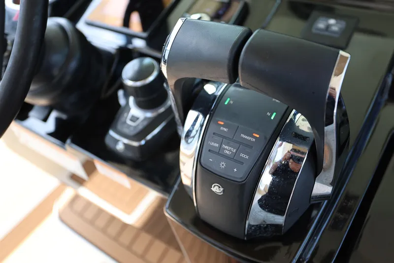 Slide: The Image of Throttle controls on 2022 Scout 330 LXF boat dashboard, featuring modern design and technology. - 22