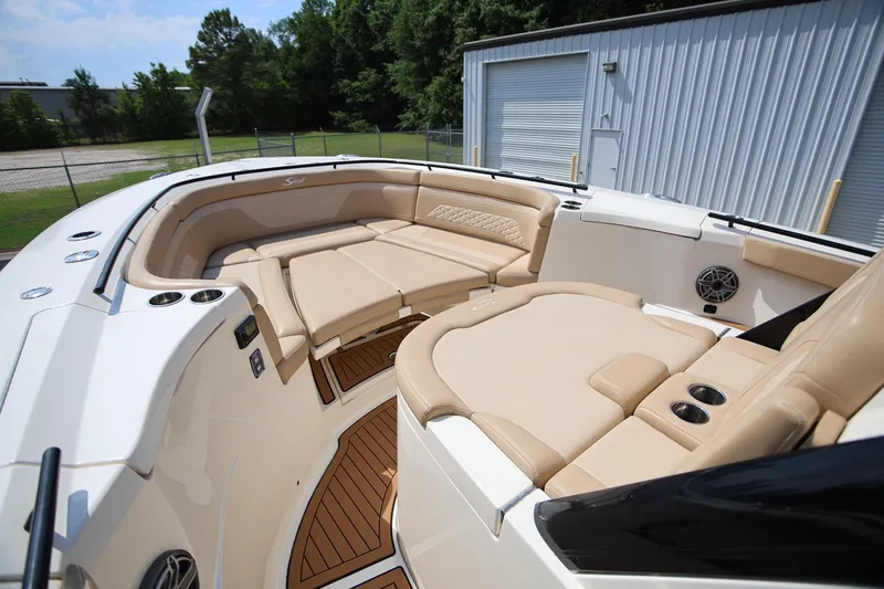 Slide: The Image of Luxurious seating area on 2022 Scout 330 LXF boat with tan upholstery. - 23