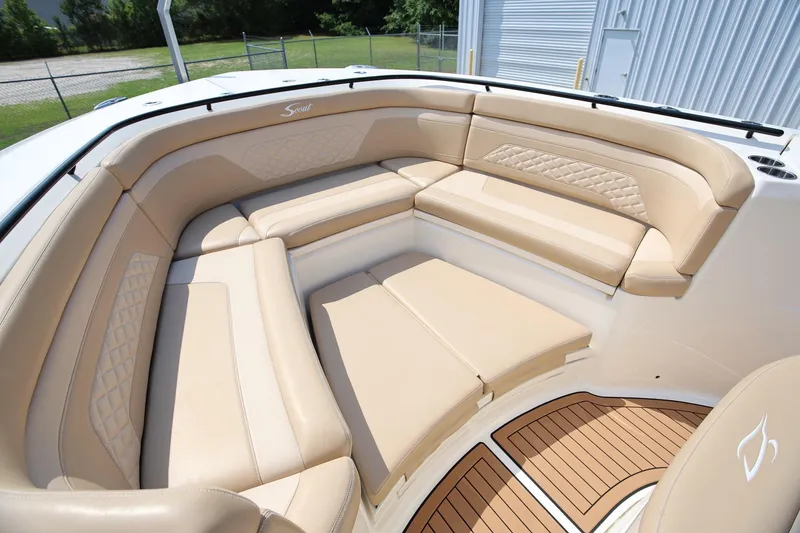 Slide: The Image of Luxurious seating area on 2022 Scout 330 LXF boat with tan upholstery. - 27