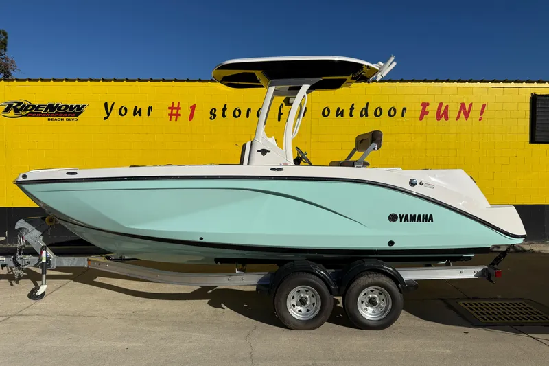 The Image of 2026 Yamaha Boats 222 FSH Sport E in mint green, parked on a trailer. - 0
