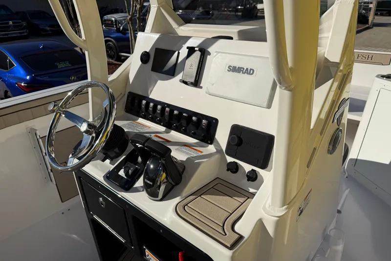 Slide: The Image of 2026 Yamaha Boats 222 FSH Sport E dashboard with steering wheel and controls. - 15