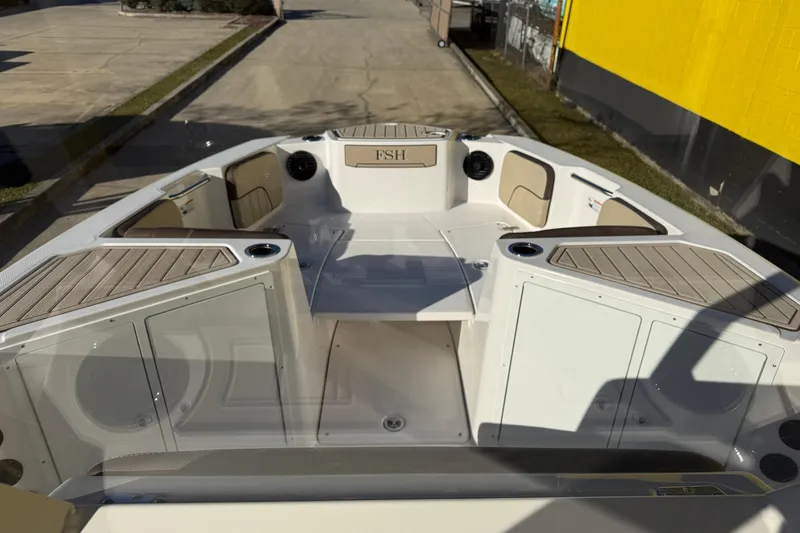 Slide: The Image of 2026 Yamaha Boats 222 FSH Sport E interior with seating and storage compartments. - 20