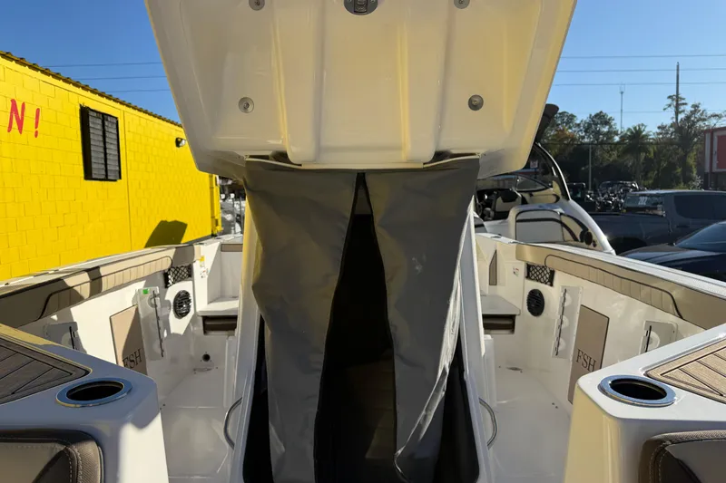 Slide: The Image of 2026 Yamaha Boats 222 FSH Sport E interior with seating and storage compartments. - 27