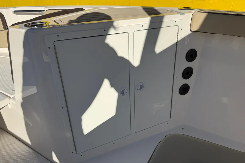 Slide: The Image of 2026 Yamaha Boats 222 FSH Sport E interior storage compartment with sleek design and modern features. - 30