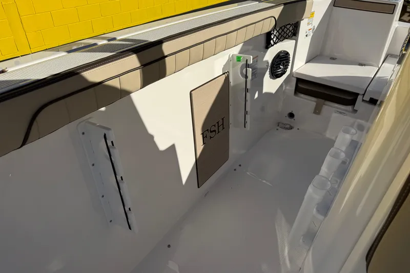 Slide: The Image of 2026 Yamaha Boats 222 FSH Sport E interior with seating and storage features. - 32