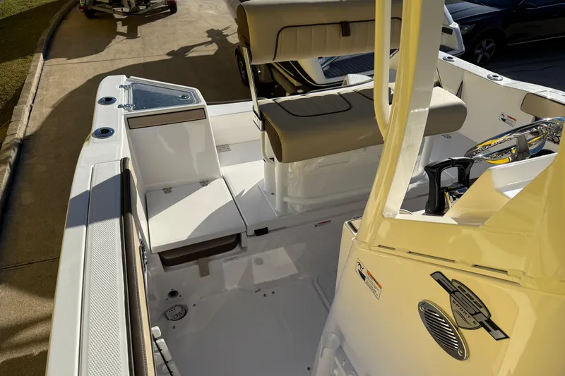 Slide: The Image of 2026 Yamaha Boats 222 FSH Sport E interior with seating and storage features. - 33