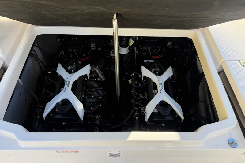 Slide: The Image of 2026 Yamaha Boats 222 FSH Sport E engine compartment with twin engines visible. - 37