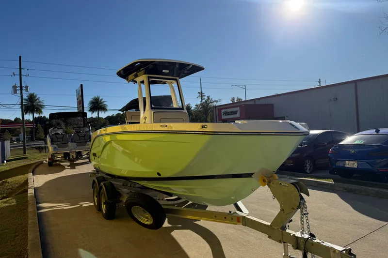 Slide: The Image of 2026 Yamaha Boats 222 FSH Sport E on trailer under bright sunlight. - 6