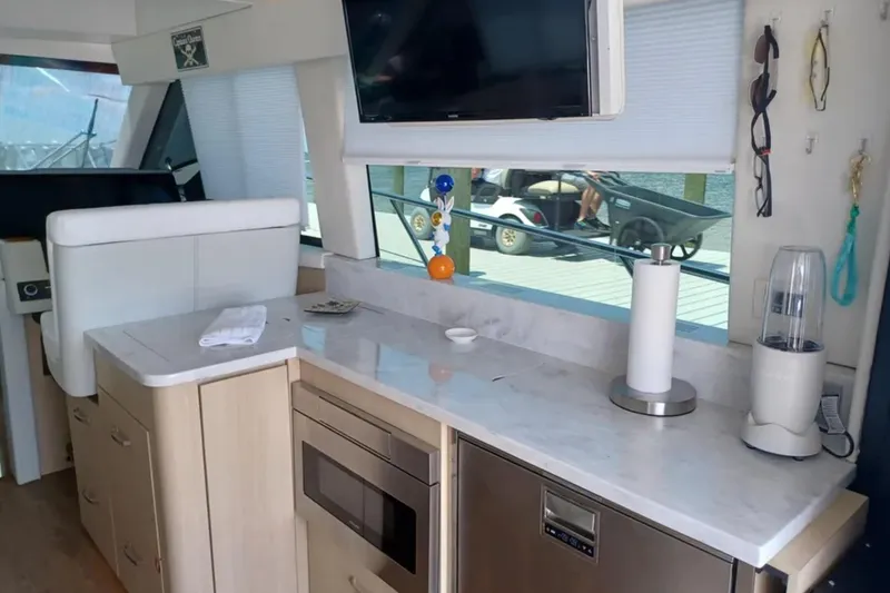 Slide: The Image of Luxurious interior of 2023 Regal 42 FXO yacht with modern kitchen amenities. - 20