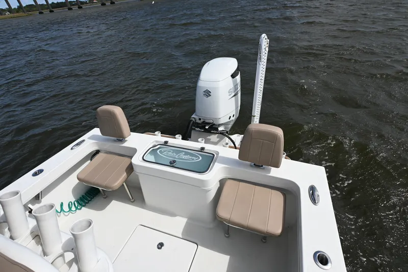 Slide: The Image of 2022 Pair Customs 21 Center Console DV boat with Suzuki outboard motor on water. - 10