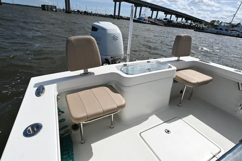 Slide: The Image of 2022 Pair Customs 21 Center Console DV boat interior with seating and water view. - 11