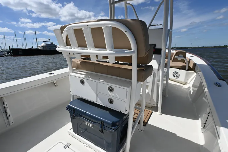 Slide: The Image of 2022 Pair Customs 21 Center Console DV boat interior with seating and storage. - 12