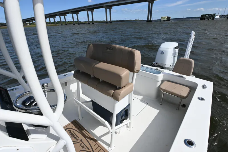Slide: The Image of 2022 Pair Customs 21 Center Console DV boat on water near a bridge. - 14