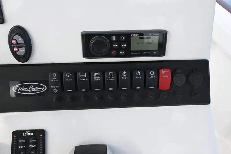 Slide: The Image of 2022 Pair Customs 21 Center Console DV dashboard with control panel and audio system. - 18