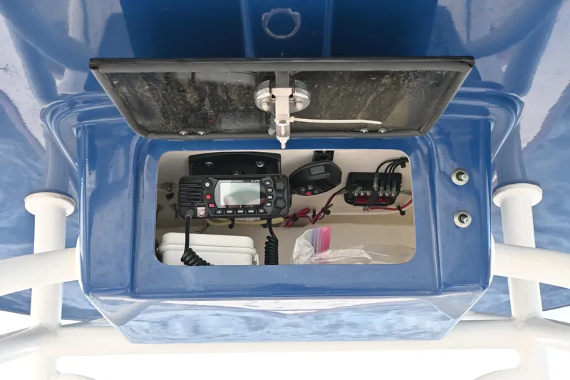 Slide: The Image of 2022 Pair Customs 21 Center Console DV electronics compartment with radio and wiring. - 19
