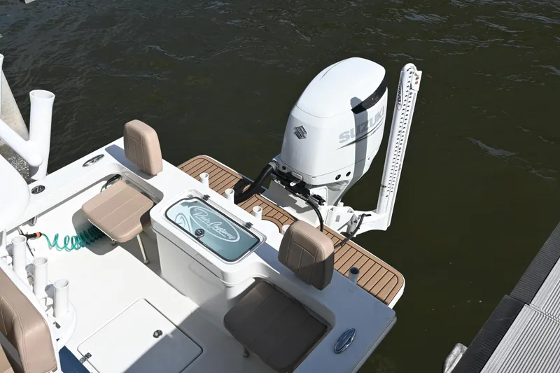 Slide: The Image of 2022 Pair Customs 21 Center Console DV boat with Suzuki outboard motor on water. - 23