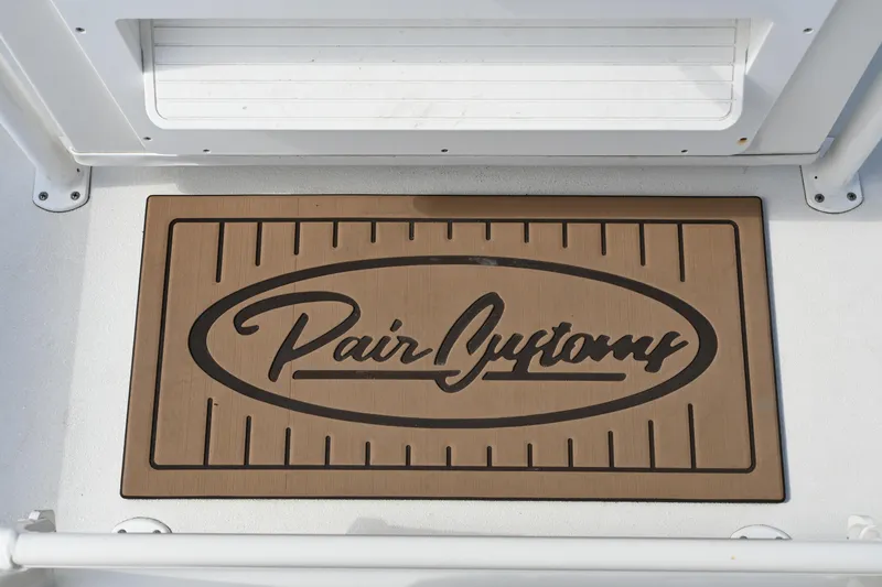 Slide: The Image of Pair Customs 21 Center Console DV 2022 boat deck with branded mat. - 24