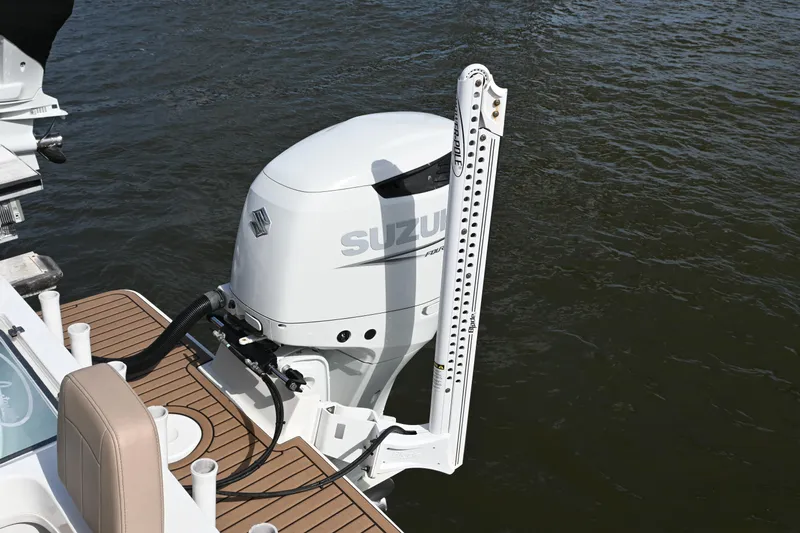Slide: The Image of 2022 Pair Customs 21 Center Console DV with Suzuki outboard motor on water. - 25