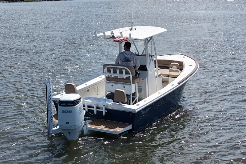 Slide: The Image of 2022 Pair Customs 21 Center Console DV boat on water, rear view. - 4